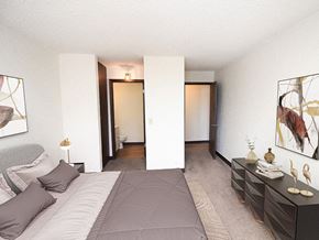 Sioux City apartment for rent - apartment bedroom with a large bed and a bathroom