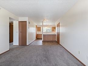 Fremont apartment for rent - living room with a kitchen in the background