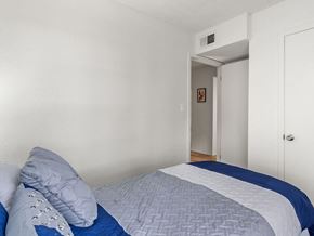 Roswell apartment for rent - a bedroom with a bed and a door to a hallway
