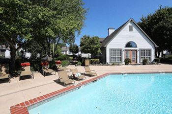 Sparkling swimming pool with sundeck