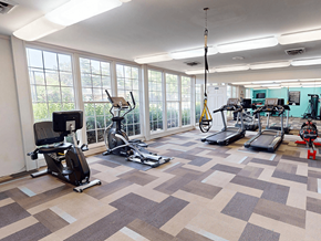 Ballwin townhouse for rent - A gym with a variety of exercise equipment.