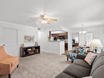 Topeka apartment for rent - a living room with a couch and a ceiling fan