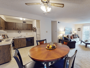 Sappington townhouse for rent - A dining room with a wooden table and chairs.