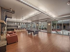 Akron apartment for rent - a large room with a pool table and chairs