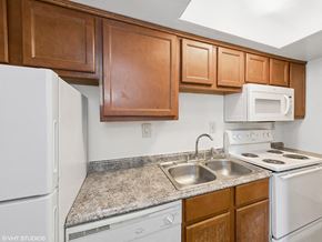 West Chester apartment for rent - apartment kitchen with appliances and wooden cabinets