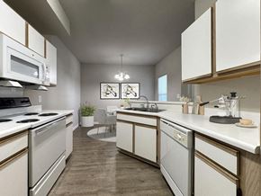 Fayetteville apartment for rent - a kitchen with white cabinets and a counter top