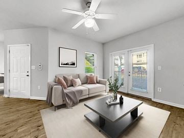 Fayetteville apartment for rent - a living room with a couch and a ceiling fan