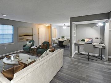 Little Rock apartment for rent - a living room with a couch and a table