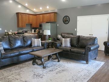 Terre Haute apartment for rent - a living room with leather couches and a coffee table
