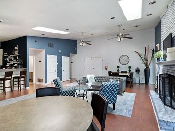 Maumee apartment for rent - a living room with blue walls and a table and chairs