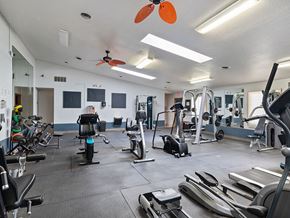 Maumee apartment for rent - a gym with weights and cardio equipment