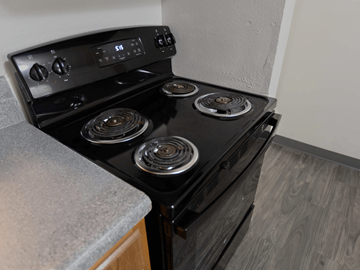 St. Louis townhouse for rent - a black stove top oven in a kitchen