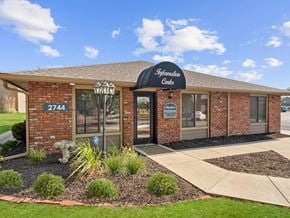 Topeka townhouse for rent - the front of a building with a sign on it