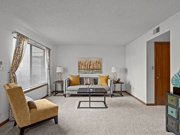 Topeka townhouse for rent - a living room with a couch and a table