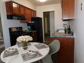 Brooklyn Park apartment for rent - Connected living and dining area at West Broadway Apartments