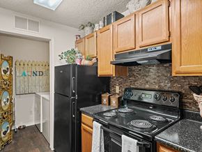 Kansas City apartment for rent - apartment kitchen with a stove and a refrigerator