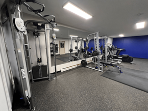 Brooklyn Park apartment for rent - a fully equipped gym with free weights and cardio equipment
