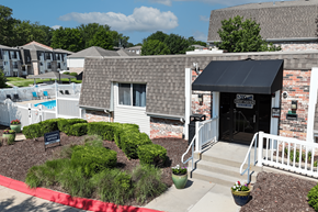 Omaha townhouse for rent - A leasing office in a brick building.