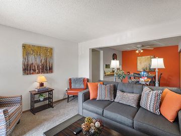 Lenexa apartment for rent - a living room with a couch and a table
