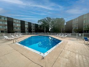 Saint Joseph apartment for rent - a swimming pool in front of an apartment building