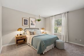 Greensboro apartment for rent - a bedroom with a bed and a window