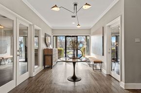 Greensboro apartment for rent - a dining room with a table and chairs in front of a window