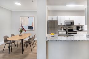 Durham apartment for rent - A modern kitchen with a dining table and chairs.