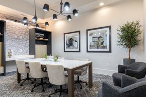 Fayetteville apartment for rent - a conference room with a table and chairs and a plant