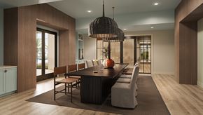 Ocean Isle Beach apartment for rent - A modern dining room with a dark wood table and chairs.