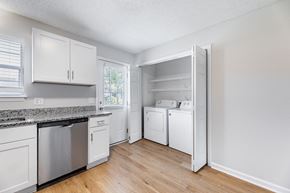 Winterville apartment for rent - A kitchen with white cabinets and appliances.