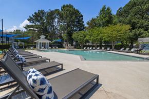 Greensboro apartment for rent - a swimming pool with lounge chairs next to a resort style pool
