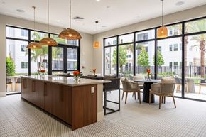 Winter Garden apartment for rent - A kitchen with a table and chairs in front of a window.