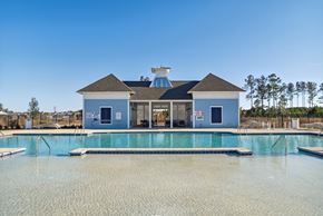 Longs apartment for rent - A large swimming pool in front of a pool house at 15 at Heron in Longs, SC.