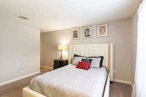 Port Orange apartment for rent - the preserve at ballantyne commons bedroom with white bed and framed pictures