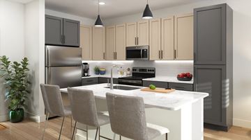 Charleston apartment for rent - A modern kitchen with a white island and grey chairs.
