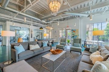 Chapel Hill apartment for rent - A spacious living room with a grey sofa set and a large coffee table.