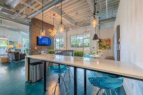 Chapel Hill apartment for rent - A modern office space with a long table and chairs.
