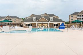 High Point apartment for rent - Building in the Background with Pool in Front of it.