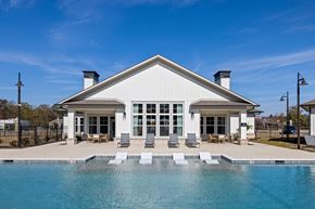 Opelika apartment for rent - A white house with a pool in front.