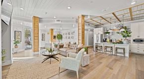 Myrtle Beach apartment for rent - A modern open-plan living and kitchen area with a dining table set for four.