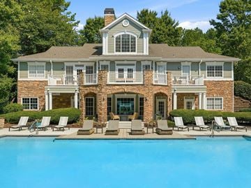 Birmingham apartment for rent - A large house with a pool in front.