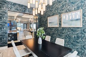 Raleigh apartment for rent - A seating area with a black table and chairs at Parker Apartments in Raleigh, NC.