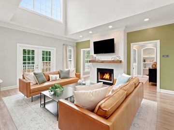 Birmingham apartment for rent - A living room with a fireplace and a television on the wall.