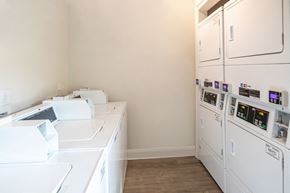 Kennesaw apartment for rent - a kitchen with white appliances and a counter top and a refrigerator