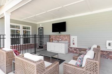 Madison apartment for rent - a living room with furniture and a television on the wall