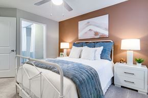 Murfreesboro apartment for rent - A bedroom with a white bed and a white nightstands