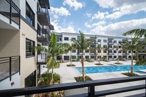 Fort Myers apartment for rent - a view of the pool from a balcony of an apartment building