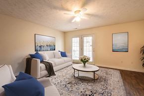 Fayetteville apartment for rent - a living room with a white couch and a coffee table