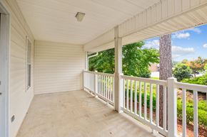 Winterville apartment for rent - a covered porch with a view of the yard and trees
