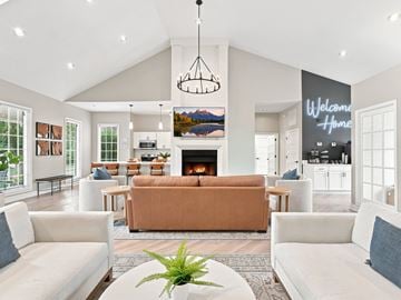 Knoxville apartment for rent - A living room with a large couch and a fireplace.